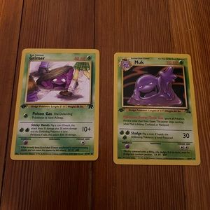 1st edition Team Rocket Grimer and 1st edition fossil Muk. Not bad condition.